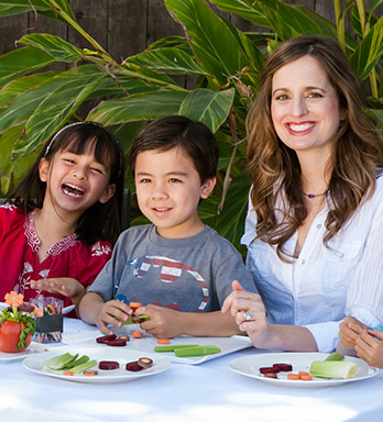 Melissa Halas with kids at table